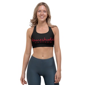 Könnte beinhalten: Schwarzer Sport-BH mit rotem "tanzstudio HAGENOW" Logo.