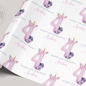May include: White wrapping paper with a repeating pattern of pink number fours, unicorn heads with purple and gold details, and the text "Happy 4th Birthday Amber".