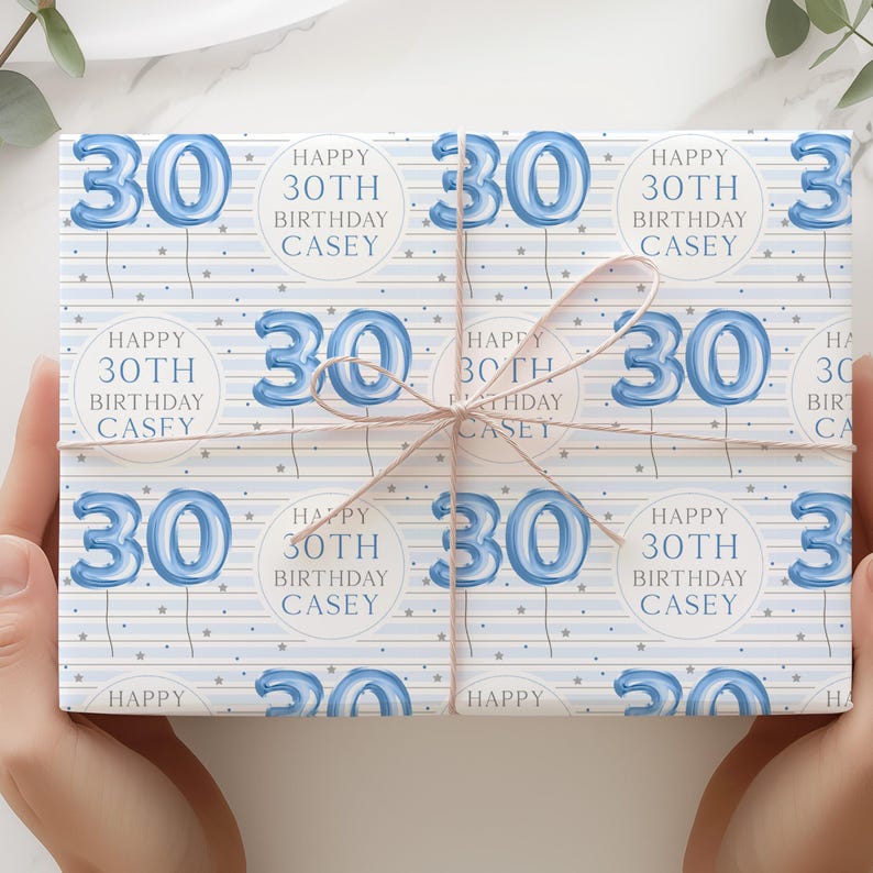 May include: Blue and white wrapping paper with a repeating pattern of blue number 30 balloons and the text "Happy 30th Birthday Casey".