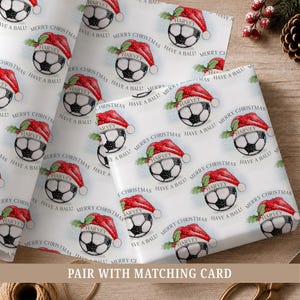 Personalised football Christmas wrapping paper featuring a festive football in a Santa hat, personalised with a name, relation and Have a Ball wording.