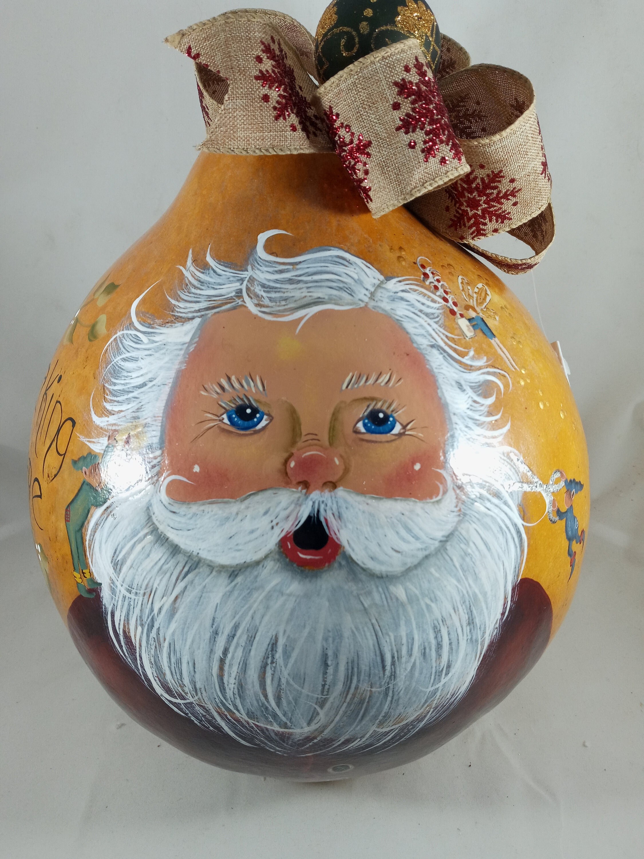 CARING FOR SANTA is a hand painted gourd