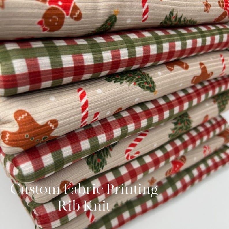 May include: A stack of custom printed rib knit fabric featuring Christmas-themed patterns. The designs include gingerbread men, candy canes, Christmas trees, and red and green plaid on a beige background. The text "Custom Fabric Printing Rib Knit" is visible.