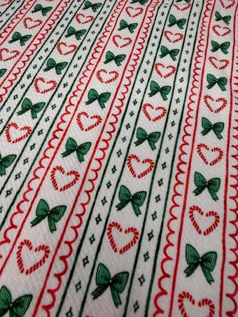 Christmas Bows and Candy Cane Bullet Fabric on bullet liverpool knit fabric