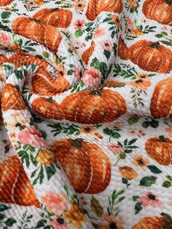 Cate & Rainn Watercolor Pumpkin and Floral Bullet Fabric on bullet liverpool knit fabric