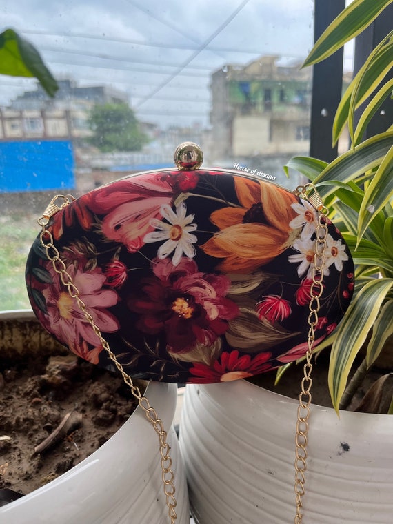 Red floral clutch bag hotsell