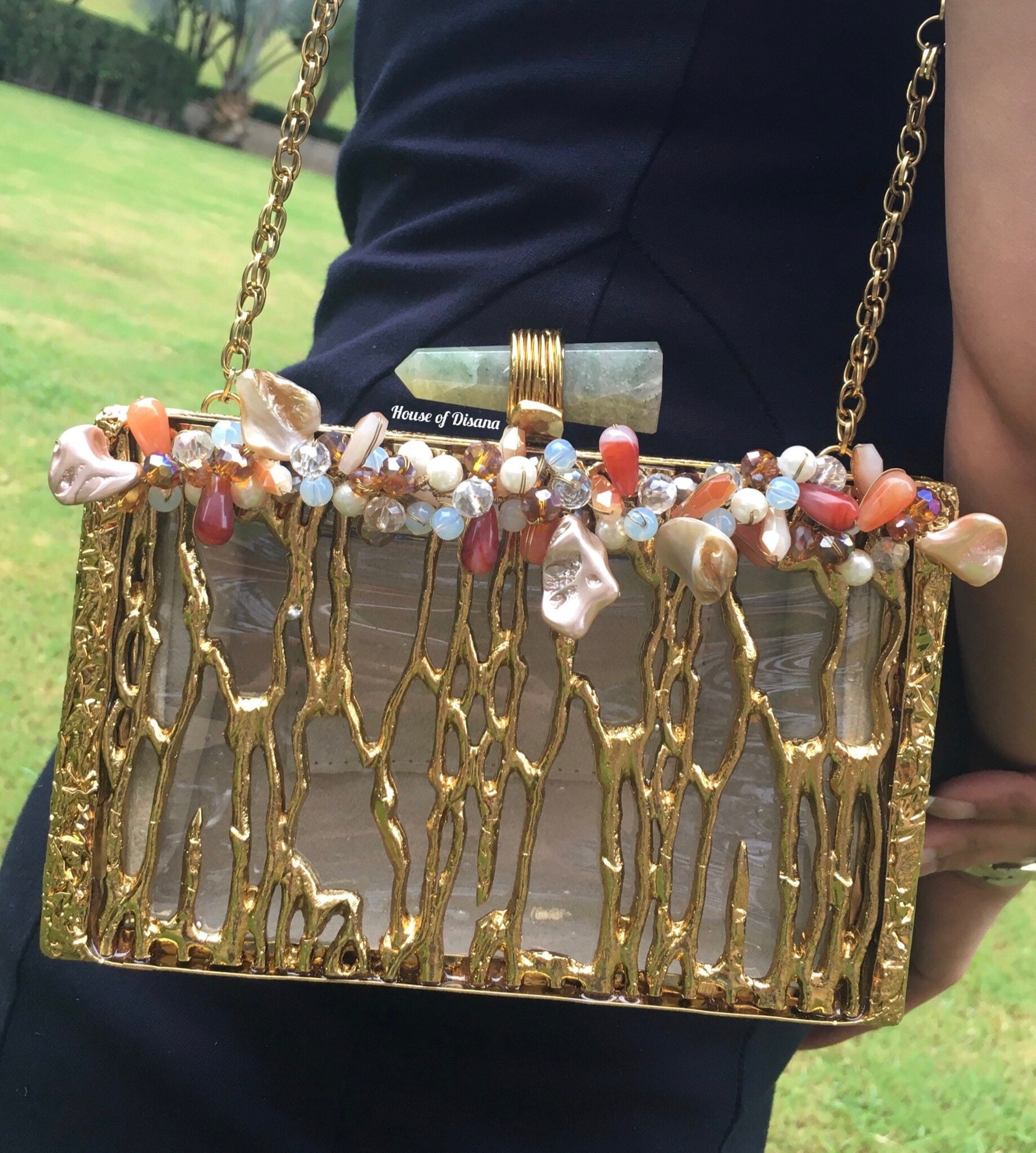 Gold cage hotsell clutch bag