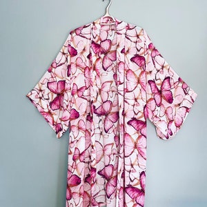 Cover Up or Duster Coat ,Chiffon Floaty Butterfly design.Perfect over a dress or as a cover up on your hols.The fabric is very sheer