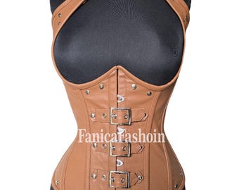 May include: A brown leather corset with a halter neck and crisscross straps. The corset features multiple silver buckles and rivets. The text "Fanicafashoin" is printed on the front of the corset.
