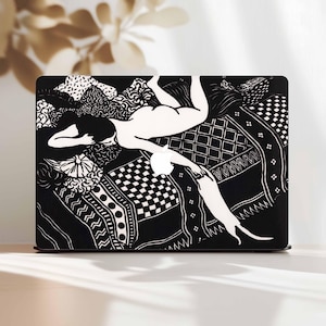 May include: Black and white laptop case featuring an artistic illustration of a reclining figure on a patterned surface. The design includes various geometric and floral patterns, with the Apple logo visible.