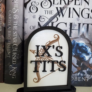 OFFICIALLY LICENSED Carissa Broadbent &quot;Ix&#39;s T*ts&quot; Crowns of Nyaxia shelf sitter sign for library display, Oraya and Raihn books