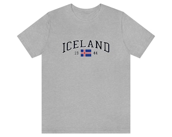 May include: A gray t-shirt with the word "ICELAND" in a navy blue arch with the Icelandic flag and the numbers "19" and "44" underneath.
