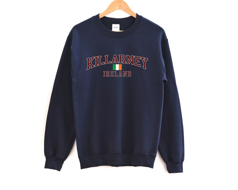 May include: Navy blue sweatshirt with the text "KILLARNEY IRELAND" in maroon with a small Irish flag graphic.