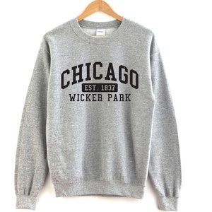 May include: Gray sweatshirt with black text that reads "CHICAGO EST. 1837 WICKER PARK"