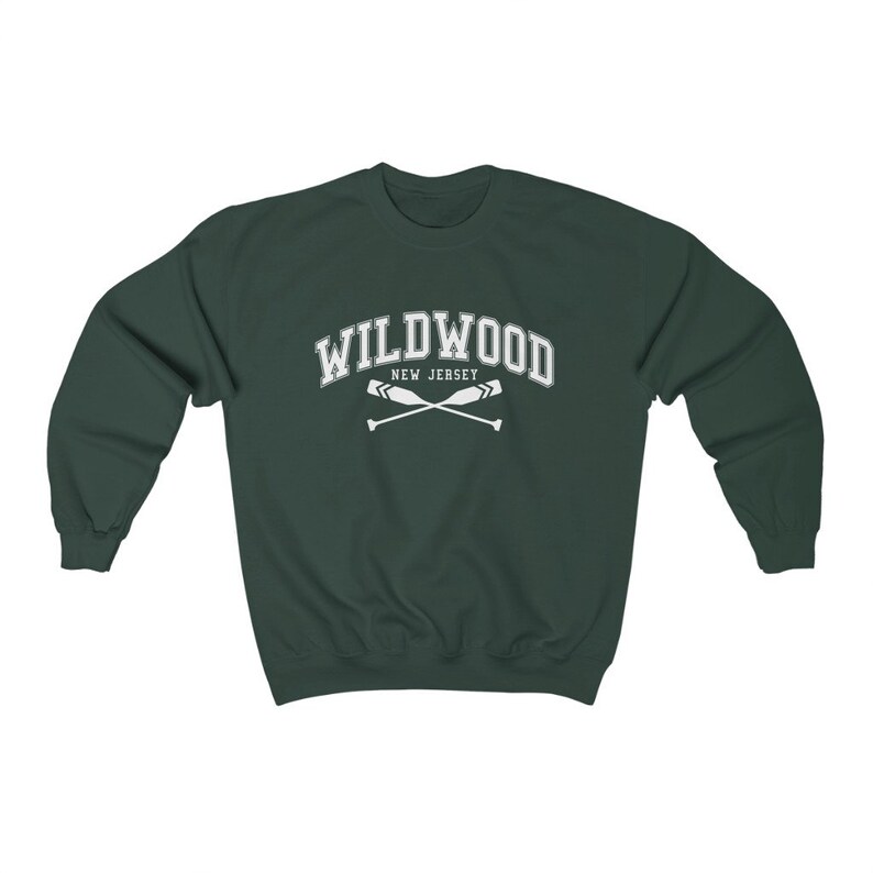 May include: A dark green sweatshirt with the text "WILDWOOD NEW JERSEY" in white with a pair of crossed oars underneath.