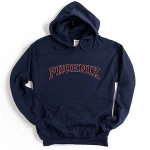 May include: Navy blue hooded sweatshirt with the word "PHOENIX" in maroon letters.