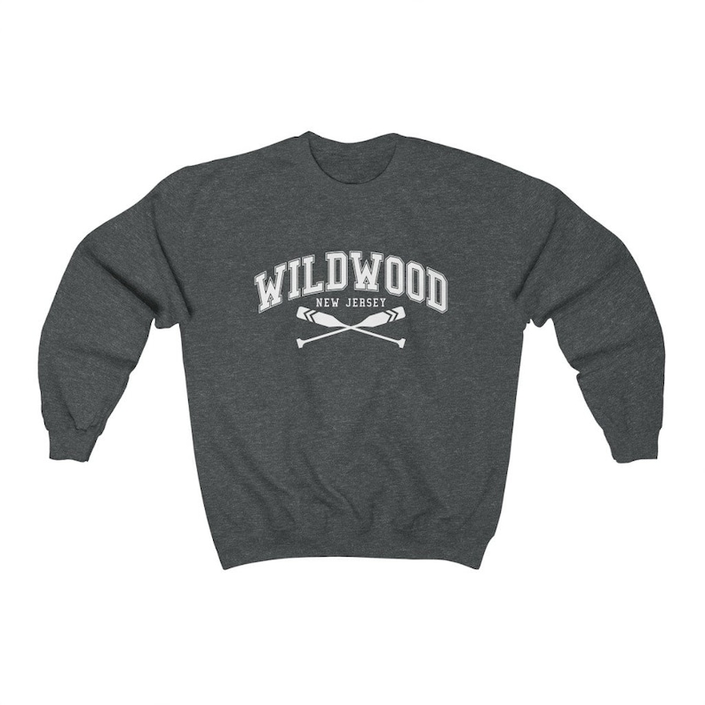 May include: A dark grey sweatshirt with the text "WILDWOOD NEW JERSEY" in white, with a pair of crossed oars underneath.
