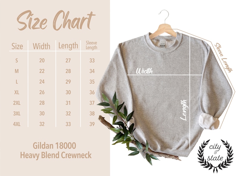 May include: A light gray Gildan 18000 Heavy Blend Crewneck sweatshirt hangs on a wooden hanger. A size chart shows measurements in inches for width, length, and sleeve length. The City & State logo is in the lower right corner.