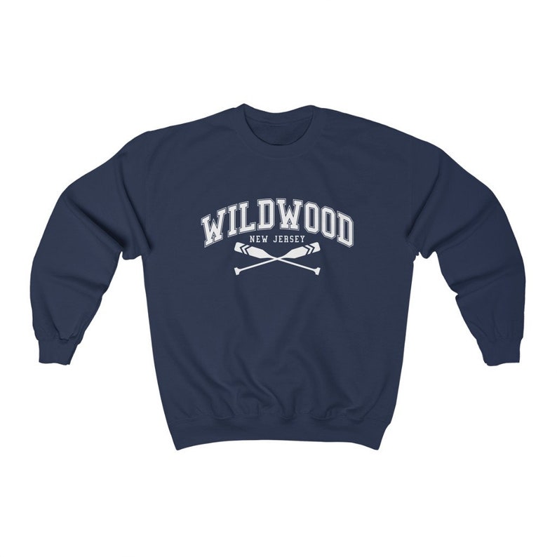 May include: Navy blue sweatshirt with white text that reads "WILDWOOD NEW JERSEY" and a pair of crossed oars.