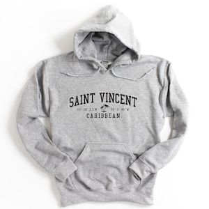 May include: Gray hooded sweatshirt with black text that reads "SAINT VINCENT 12° 30' 31.1"N 70° 1' 45"W CARIBBEAN" with a palm tree graphic.