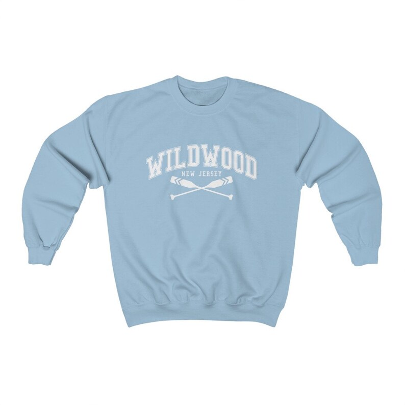 May include: Light blue sweatshirt with a white graphic that says "WILDWOOD NEW JERSEY" with two crossed oars.