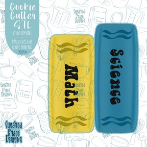 May include: Two yellow and blue cookie cutters with the words "Math" and "Science" in black lettering. The cookie cutters are on a white background with a pattern of kitchen utensils.