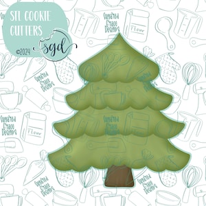 May include: Green Christmas tree cookie cutter with a brown trunk. The cutter is surrounded by a white background with a pattern of kitchen tools and the text "Sugared Grace Designs" repeated.