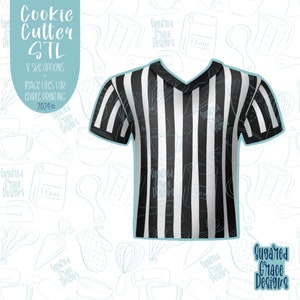 May include: A black and white striped referee shirt cookie cutter. The cutter is designed to look like a referee's shirt with a V-neck and short sleeves. The background is a white pattern of various baking tools and equipment.