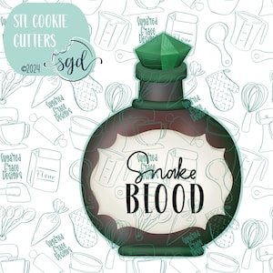 May include: A dark brown cookie cutter shaped like a potion bottle, topped with a green gem. The label reads "Snake Blood" in black script. The background features baking-themed illustrations.