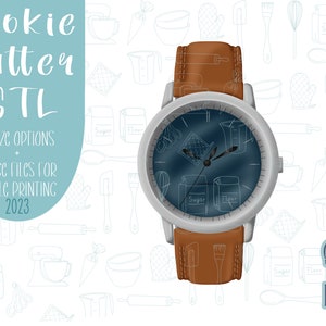 May include: A silver watch with a brown leather band. The watch face is blue and features a design of various baking tools and ingredients. The text "Cookie Cutter STL" is at the top of the image, and "Suggared Grace Designs" is at the bottom.
