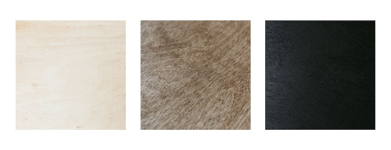K&ouml;nnte beinhalten: Drei Holzproben: ein hellbeiges Holz, ein mittelbraunes Holz mit Maserung und ein schwarzes Holz.