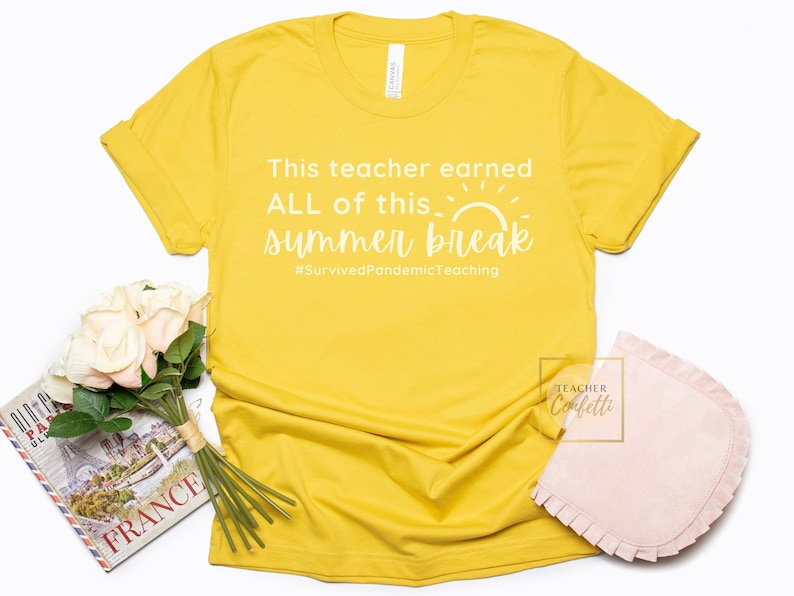 May include: Yellow t-shirt with white text that reads "This teacher earned ALL of this summer break #SurvivedPandemicTeaching".