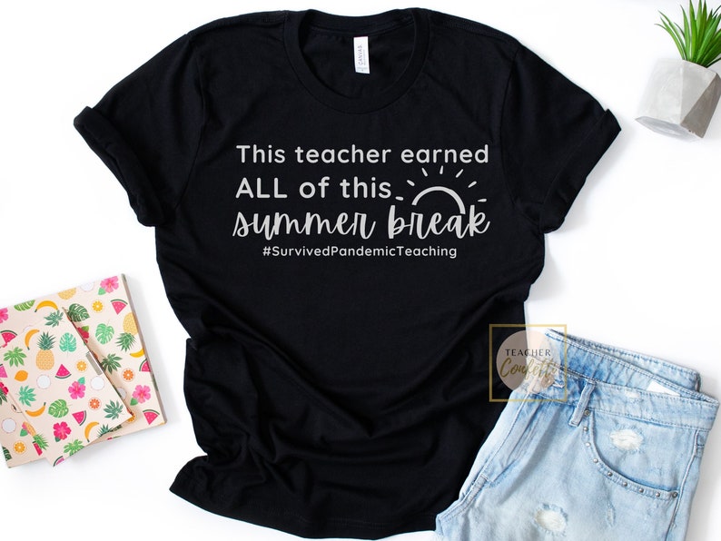 May include: Black t-shirt with white text that reads "This teacher earned ALL of this... summer break #SurvivedPandemicTeaching". The text is stylized with a sun graphic.