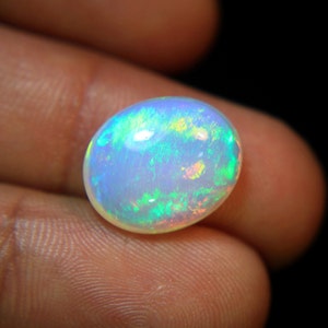 4.Ct Top Quality Natural Ethiopian Opal Oval Shape, A Gemstone for the Fiery, Sparkling and Unique Opal with Fire and Rainbows image 9