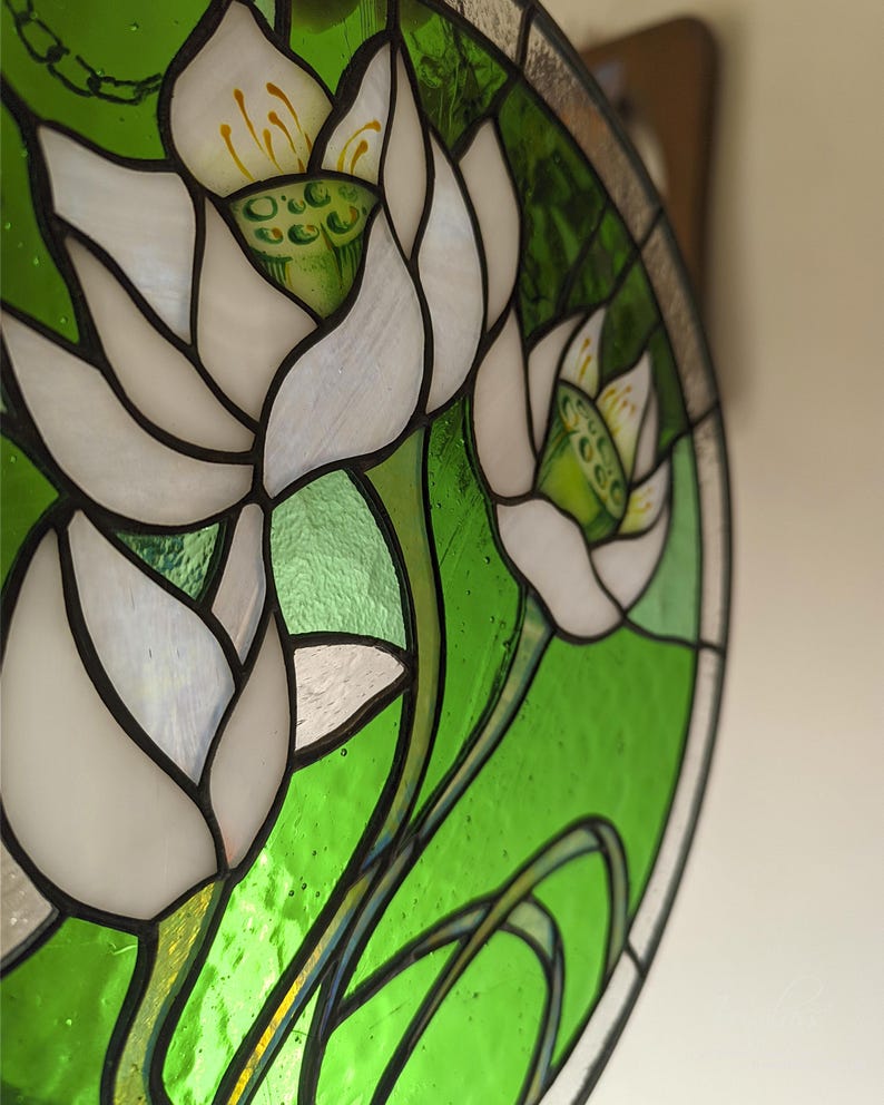 Extreme close-up, angled shot of the White Lilies stained glass panel, showing the mother-of-pearl shimmer on the petals and the intricate details of the flower stamens; a unique piece of pastel wall art and perfect mothers gift.