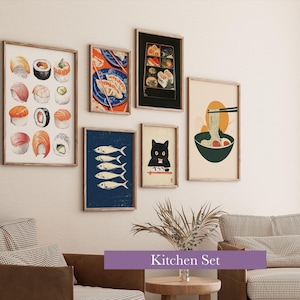 May include: A collection of framed art prints featuring sushi, fish, and ramen illustrations. The prints are in wooden frames and are displayed on a white wall above a brown sofa and chair. The text "Kitchen Set" is displayed on a purple banner.