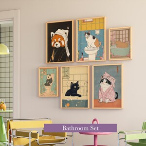 May include: A set of six framed art prints featuring whimsical animal illustrations in a bathroom theme. The artwork includes a red panda, cats, and a panda bear, all depicted in various bathroom settings. The text "Bathroom Set" is displayed.