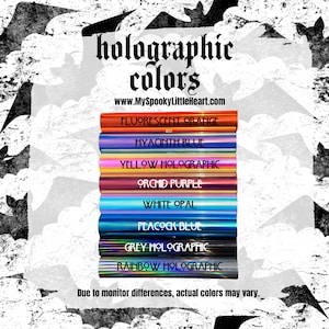 May include: A collection of holographic vinyl sheets in various colors, including fluorescent orange, hyacinth blue, yellow holographic, orchid purple, white opal, peacock blue, grey holographic, and rainbow holographic. The text "holographic colors" and "www.MySpookyLittleHeart.com" is displayed above the sheets. The text "Due to monitor differences, actual colors may vary." is displayed below the sheets.