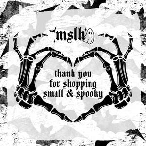 May include: Black and white illustration of two skeletal hands forming a heart shape with the text "thank you for shopping small & spooky" in the center. The background is a white and gray grunge pattern with bats.