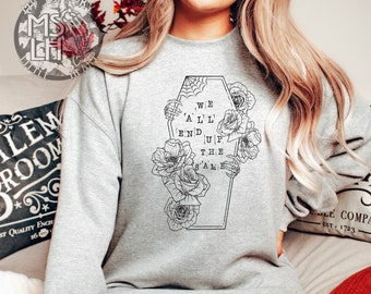 May include: Gray sweatshirt with a black graphic of a coffin with roses and the text "We 'A'L'L' End Up The Same".
