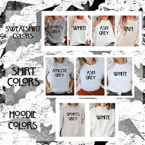 May include: A chart showing the different color options for sweatshirts, t-shirts, and hoodies. The colors include white, ash grey, sports grey, athletic grey, and tan.