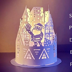 Weihnachtslaterne svg vorlage, 3d Papierschnitt schnittdatei für cricut , geschichtete papierlaterne mit weihnachtsmann und die stadt.