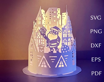Könnte beinhalten: Eine weiße Weihnachtsdorf-Szene aus Papier mit einer Weihnachtsmannfigur, die ein Geschenk hält. Das Dorf ist von innen beleuchtet und erzeugt ein warmes Leuchten. Die Szene ist perfekt für eine Weihnachtsdekoration oder ein festliches Mittelstück.