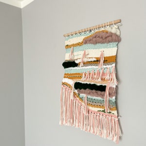 Light color weaving. Boho Wall Hanging, Woven Tapestry Art. Braided weaving cloud