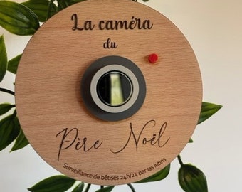 Boule de Noël " Caméra du Père noël " en bois et plexi