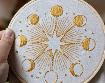 Hoop embroidery kit. Moon phases mustard screen printed design on natural cotton canvas. 6”