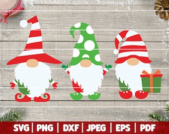 May include: Three Christmas gnomes with red and white striped hats. The gnome on the left has a green beard and red boots. The gnome in the middle has a green hat with white polka dots and green boots. The gnome on the right has a green beard and red boots and is holding a green gift box with a red ribbon.