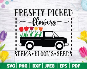 May include: A black pickup truck with a bed full of colorful flowers. The text "FRESHLY PICKED flowers" is above the truck and "STEMS • BLOOMS • SEEDS" is below the truck. The image also includes the text "SVG | PNG | DXF | JPEG | EPS | PDF".