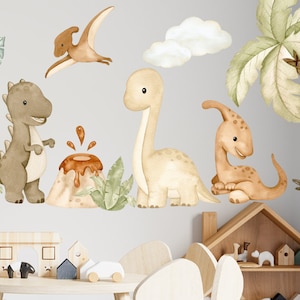 May include: A set of brown, beige, and orange dinosaur wall decals with a volcano and palm tree. The decals are perfect for a nursery or child's room.