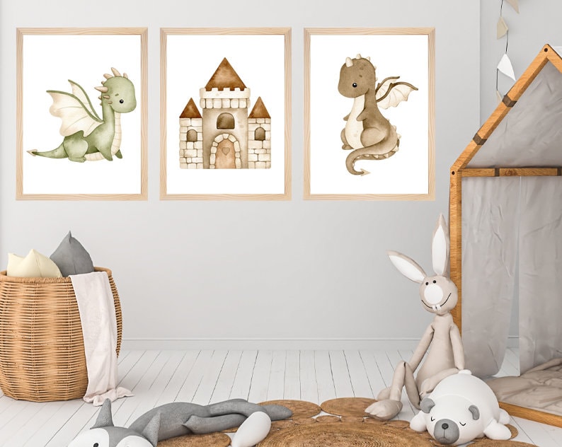 May include: Three watercolor illustrations in wooden frames, featuring a green dragon, a brown dragon, and a brown castle. The illustrations are on a white background.