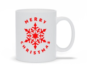 Taza de café navideña con copos de nieve rojos